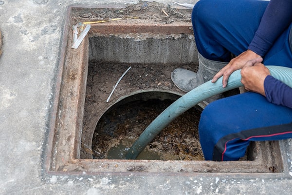 foul odors, slow drainage, and visible grease buildup are indicators that your grease trap needs pumping